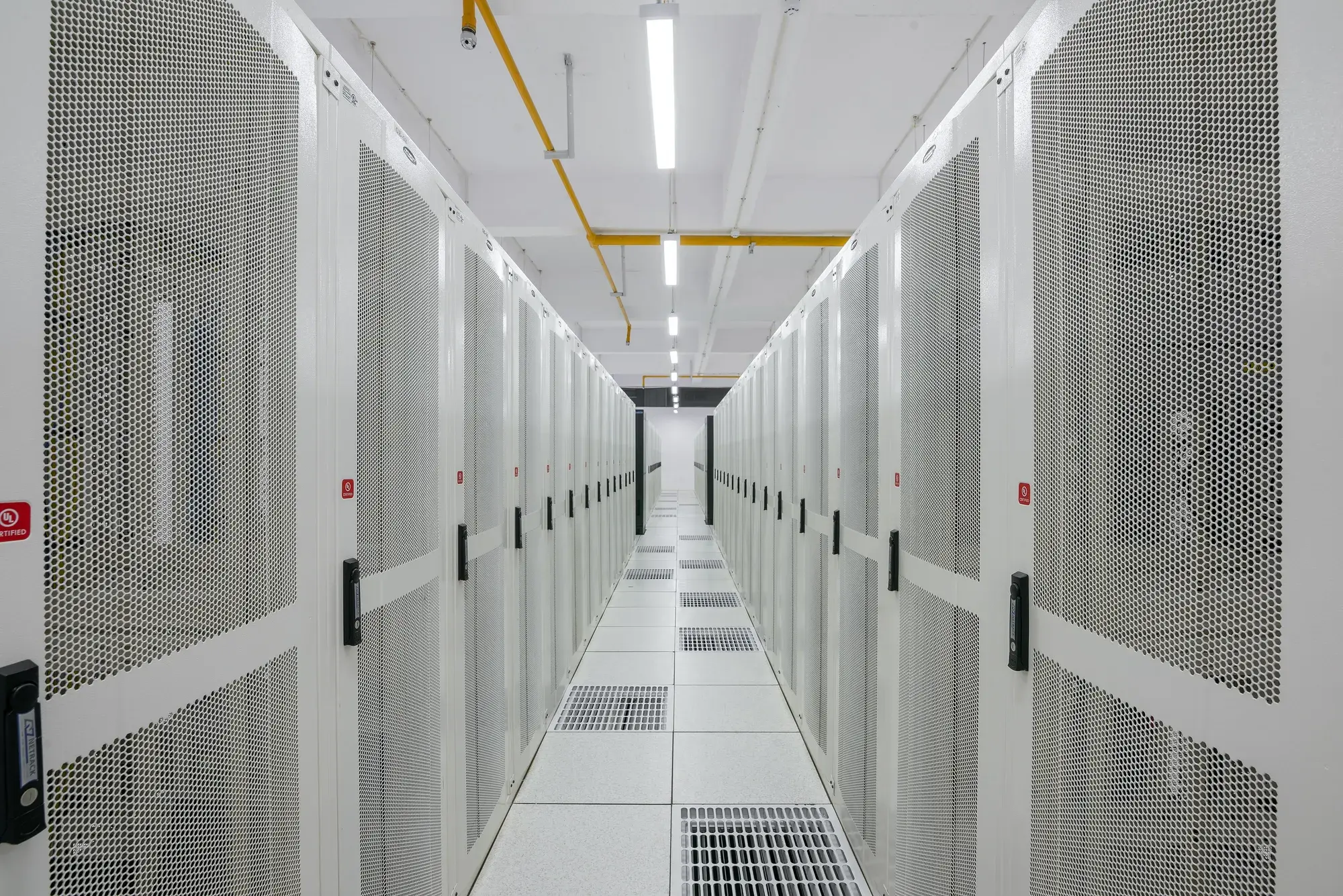 A corridor of server racks in a data center