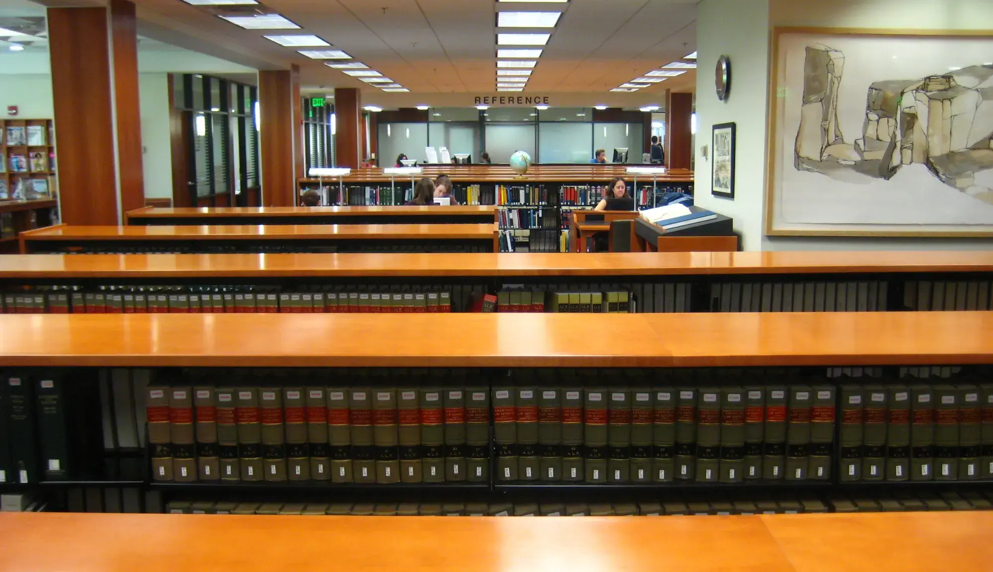 Rows of bound law reports on the shelves of a law library
