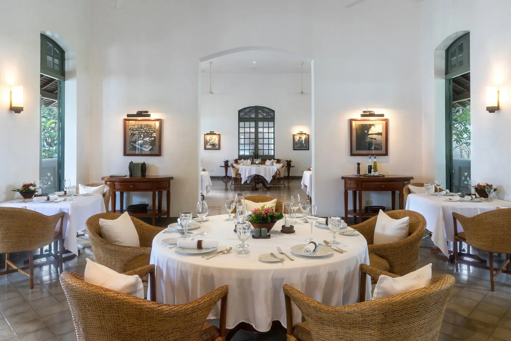 A restaurant dining room with tables laid for service